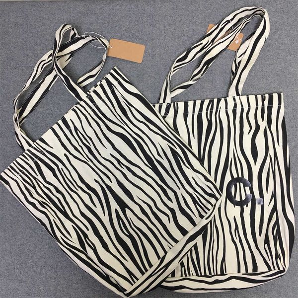 

2023 lotte japan korea zebra shopping bag handbag one shoulder portable canvas bagap