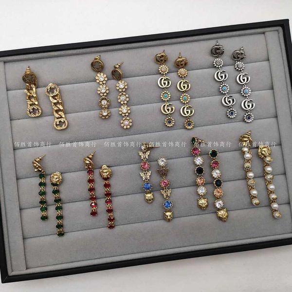 

20% off 2023 new luxury fashion jewelry for new lion's head green color bead earrings ancient classic daisy double tassel ears, Golden