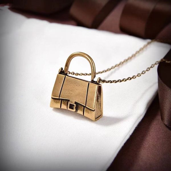 

gold chain with pendant artistic personality bag pendant necklace women, Silver