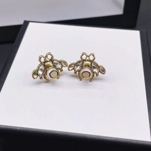 

cute bronze small bee stud earrings. full of protection, love. fashion brand designer earrings. aretes design jewels, Golden;silver