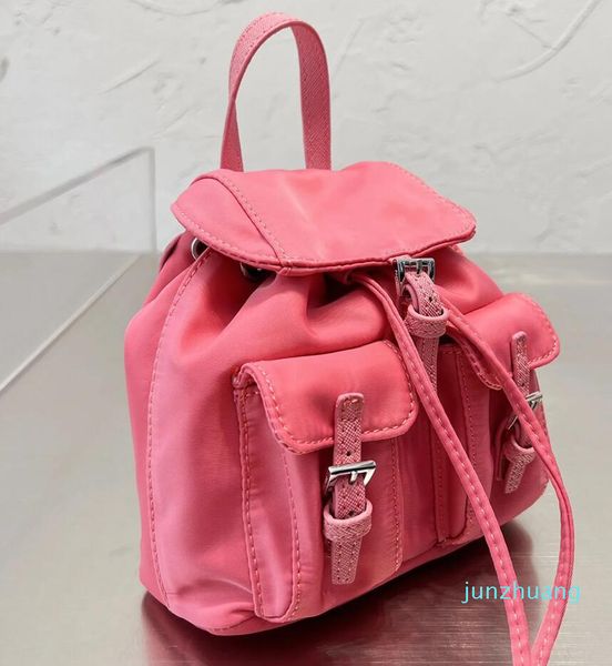 

pra da bag re-nylon medium backpack saffiano details adjustable woven nylon straps handle zipper pouch enameled metal triangle drawstring 01