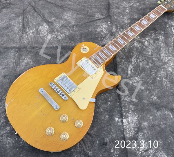 

electric guitar one piece mahognay body and neck with plain maple board hh pickups cream pickguard yellowish relic work