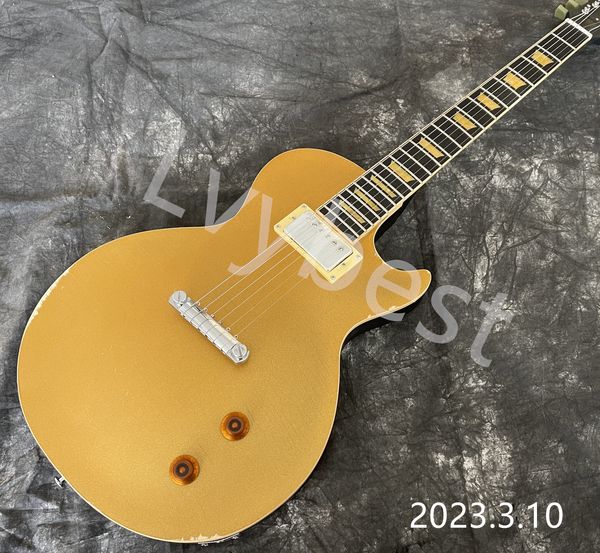 

electric guitar gold metalic only one neck pickup ebony fingreboard yellowish trapezoid shape inlay wrap round bridge tail