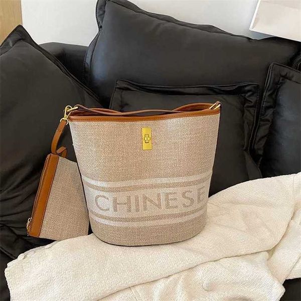 

handbag 2023 fashion women's bag leather quality handbag fashionable shoulder niche bucket advanced color contrast canvas woven handle