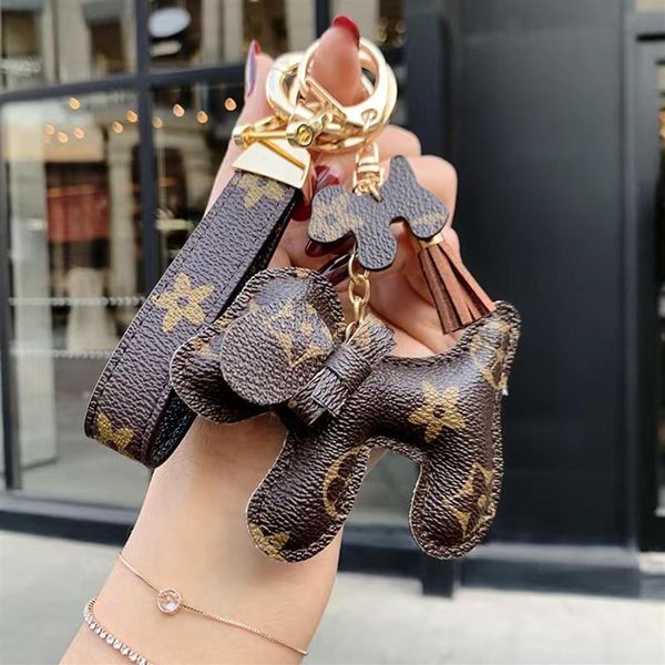 

fashion luxurys bags key chain buckle lovers car keychain handmade leather designers keychains men women bag pendant accessories282f, Red;blue