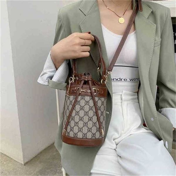 

handbag 2023 fashion women's bag leather quality handbag buckle chain bucket printed messenger bag