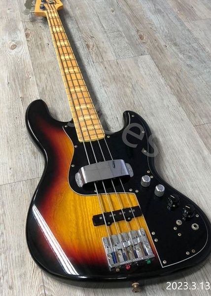 

electric bass guitar 4 strings black edge burst center red yellow skunk tail on neck back chrome parts high glossy finished