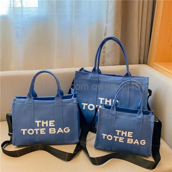 

qwertyui45 designer woman canvas tote large capacity tter fa handbag casual ladies shoulder messenger bag luxury big shopping purses 031523h