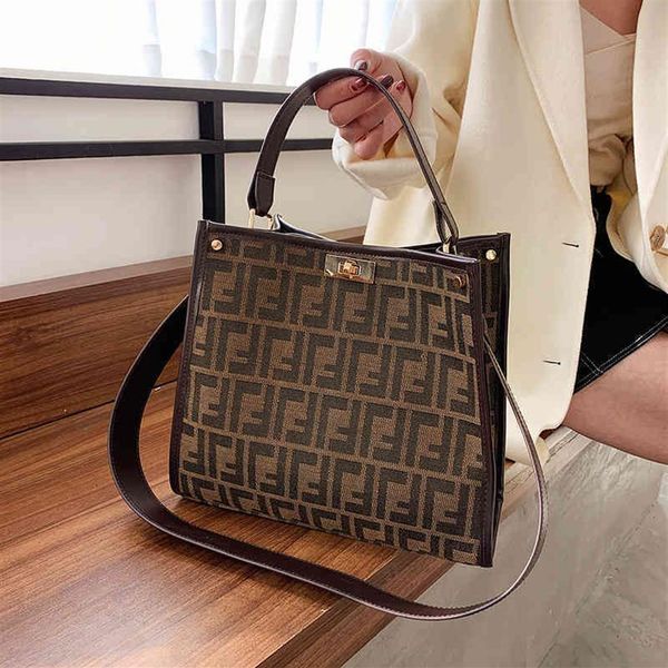 

2022 new factory whole trend tote bag canvas women's personality messenger printing big portable shoulder bag260z