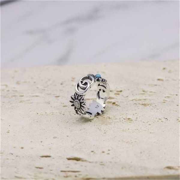 

2023 designer new fashion gu qi thai silver hollow out double daisy ring girl jewelry inlaid with turquoise