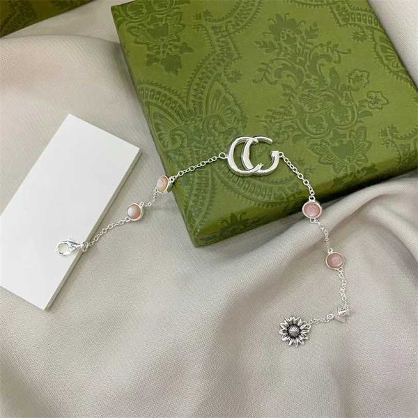 

2023 designer gujia s925 silver new style sunflower flower double g pink pearl fritillaria bracelet real picture contact customer service, Black