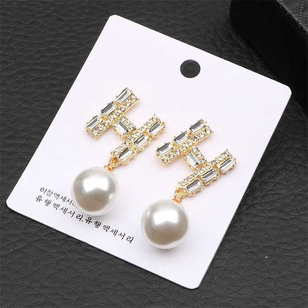 

2023 designer new feminine temperament korean personality simple bow super fairy net red 925 silver needle versatile pearl earrings, Golden