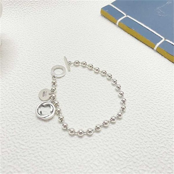 

2023 designer new jewelry silver buddha bead buckle bracelet double pendant hand decoration hip hop gift version, Black