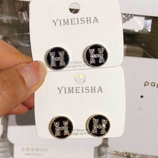 

2023 designer new 925 silver needle japanese korean black round h letter elegant and versatile rotating full diamond fashion earrings, Golden