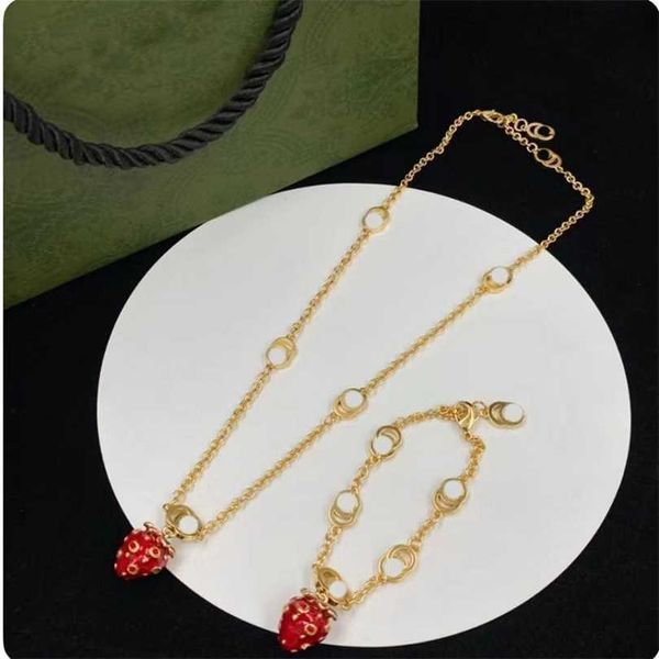 

2023 designer new double g letter strawberry pendant drop glue o-chain necklace brass fashion versatile sweater chain, Black