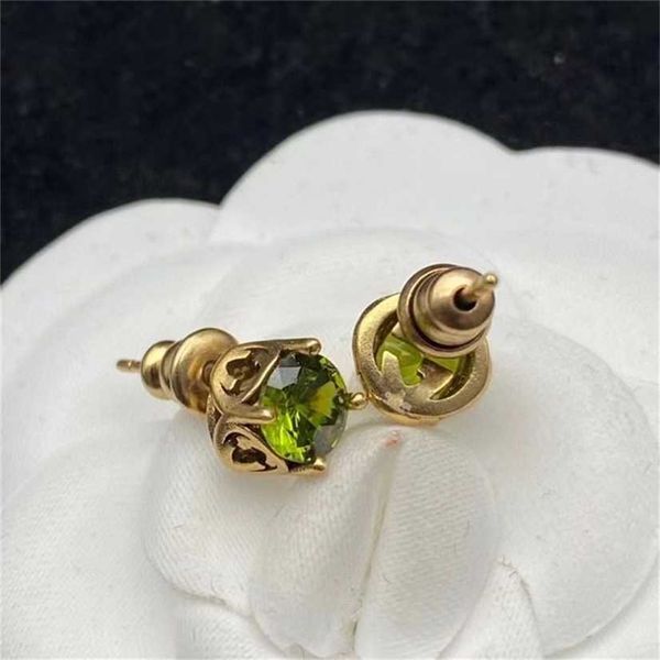 

2023 designer new jewelry double inlaid green zircon silver needle earrings designed by minority in female, Golden