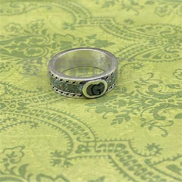 

2023 designer new jewelry sterling silver used light green enamel interlocking letter men and women couple ring
