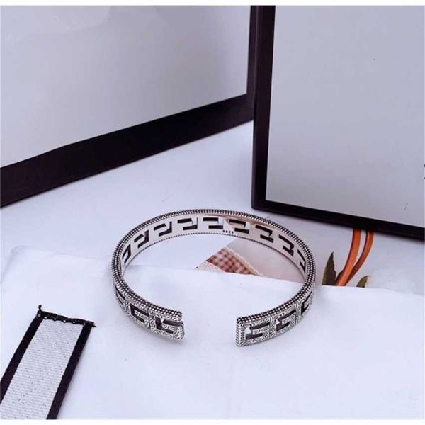 

2023 designer new fashion jewelry double hollow out bracelet for men and women silver carved pattern bracelet, Black