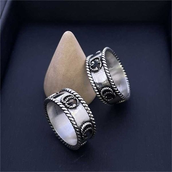 

2023 designer new fashion jewelry s925 ancient bilateral roll hemming ring, twisted interlocking letter silver ring for men and women