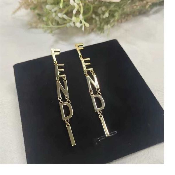 

2023 designer 2023 new f letter long tassel style brass 925 silver needle earrings female, Golden