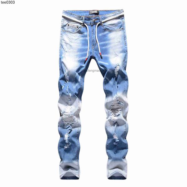 

male spring jeans blue three-dimensional cat beard knee hole high elastic jeans male