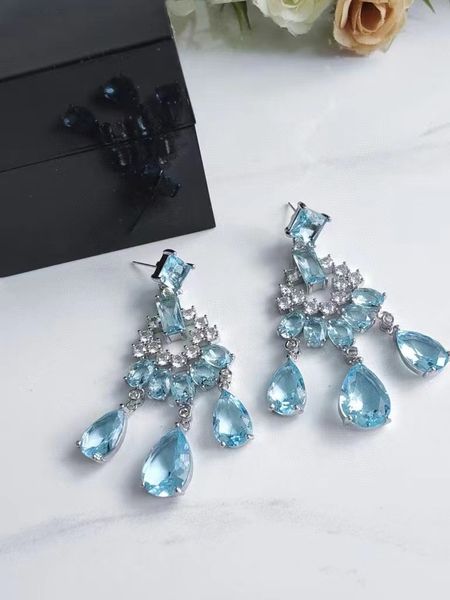 

charm light blue rhinestones go hand in hand with luxurious earrings, Golden