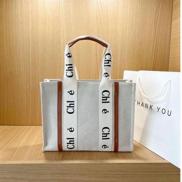 

qwqe 2022 shoulder bag letter print stripe evening bags large capacity tote canvas female japanese casual handbag shopping bags188m