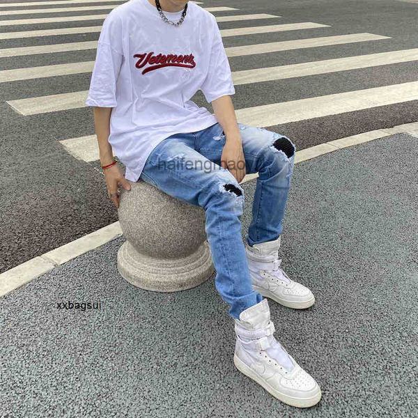 

mens jeans chao brand fog high street worn patch wash water stretch locomotive blue slim ins jeans