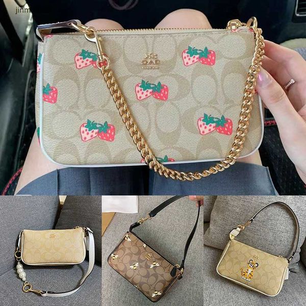 

2023new fashion bags 70% factory direct sales wholesale retail2022 olai new pearl chain underarm bag old flower single shoulder hand strawbe