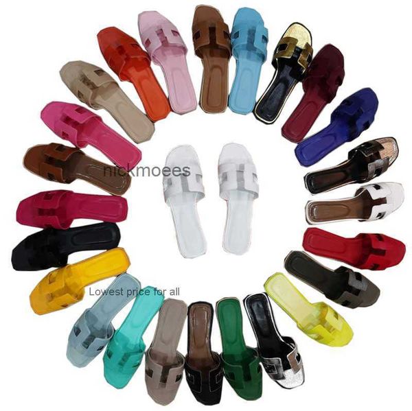 

designer slippers for women summer celebrities wearing oran sandals on flat beach leather colors black white blue brown orange gold yellow