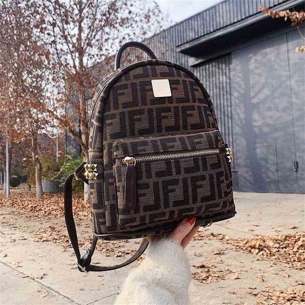 

2023 designer bag fashion canvas brown rivet backpack large capacity backpack