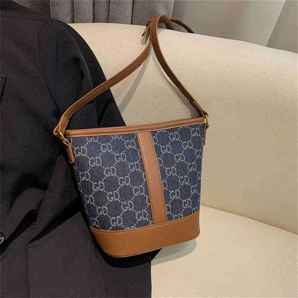 

2023 designer bag western style denim splicing contrast color bucket fashion old flower single shoulder bag texture tote bag