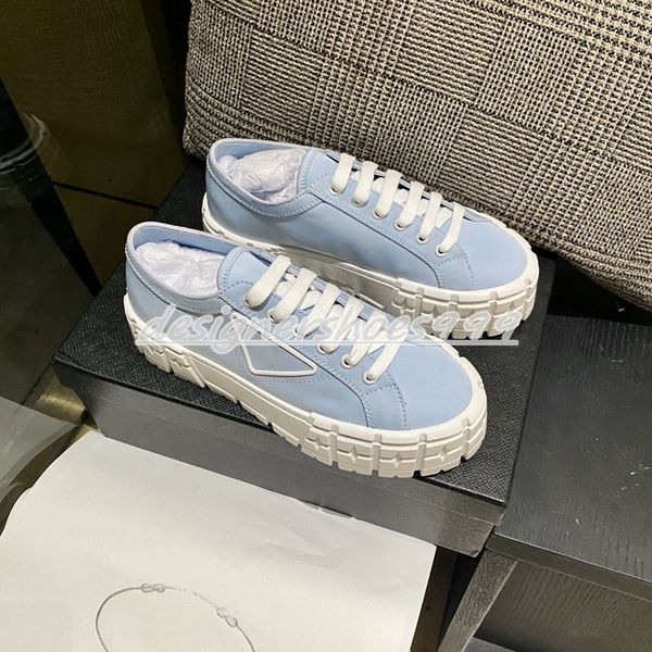 

the rubber platform inspired by the latest off-road motorcycle tires defines the extraordinary design of these nylon gabardine shoes. triang, Black