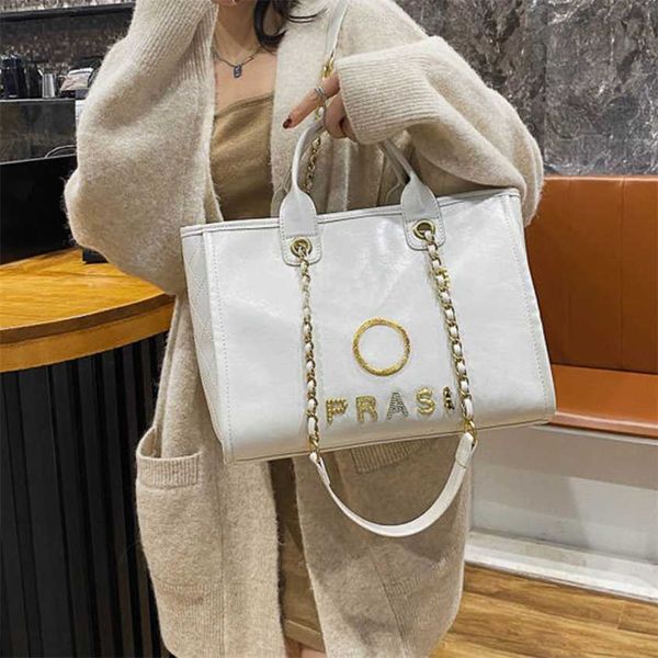 

luxury fashion handbags beach bags brand metal badge tote bag small evening handbag female capacity large leather one shoulder backpack ap9