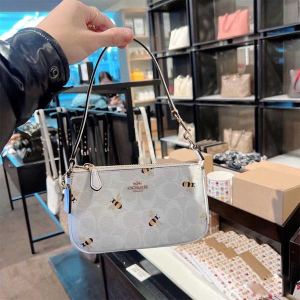

stuff sacks 2023 new glacier white bee mahjong classic old flower coating nolita19 underarm handheld bag for women