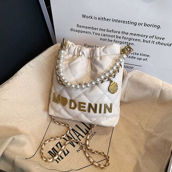 

2023 fashion handbag spring/summer new mini garbage for children's parent-child phone cross carrying pearl wrist bag