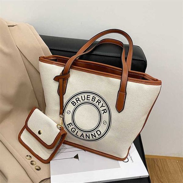 

23% 2023 fashion handbag women's commuter vogue canvas tote small design large capacity art print letter one shoulder underarm bag