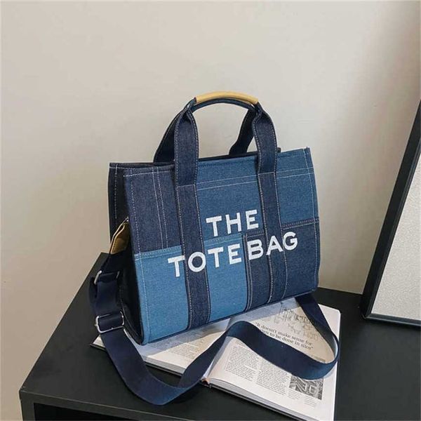

23% 2023 fashion hand new denim color contrast splicing portable tote high-grade sense minority embroidered letter messenger bag