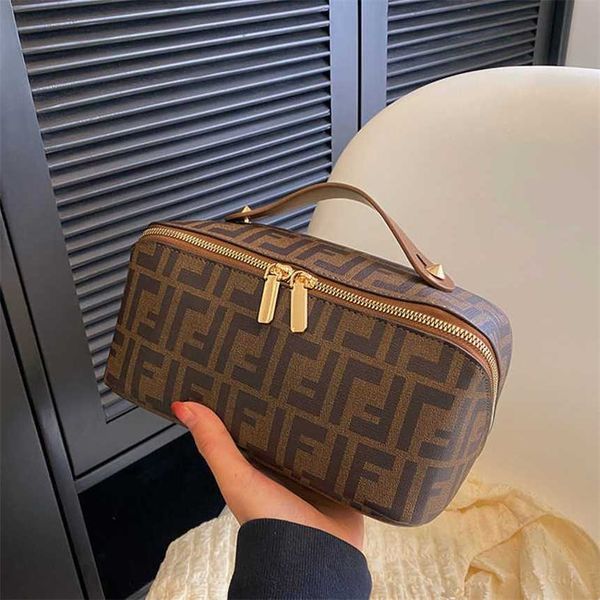 

32% 2023 fashion handbag korean handheld cosmetic women's large capacity wash advanced sense portable travel cosmetics storage bag