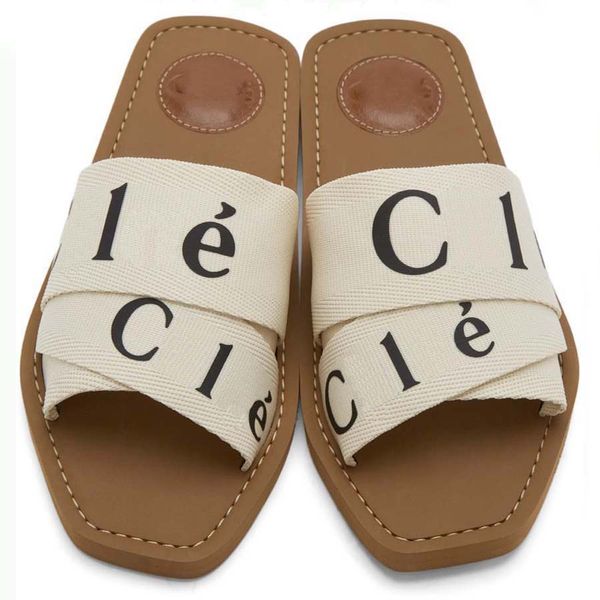 

designer slippers sliders slides sandal woody flat mule the maison's o signature adorns the inner sole the easy slip-on design makes th, Black