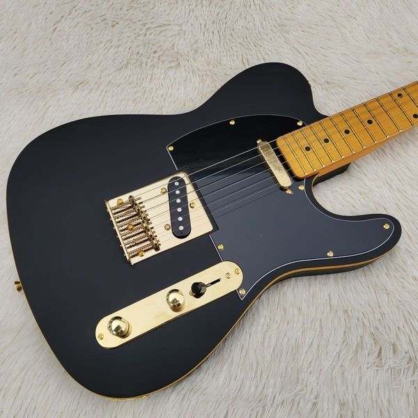 

electric guitar string wearing matte black gold piece on the back direct deal