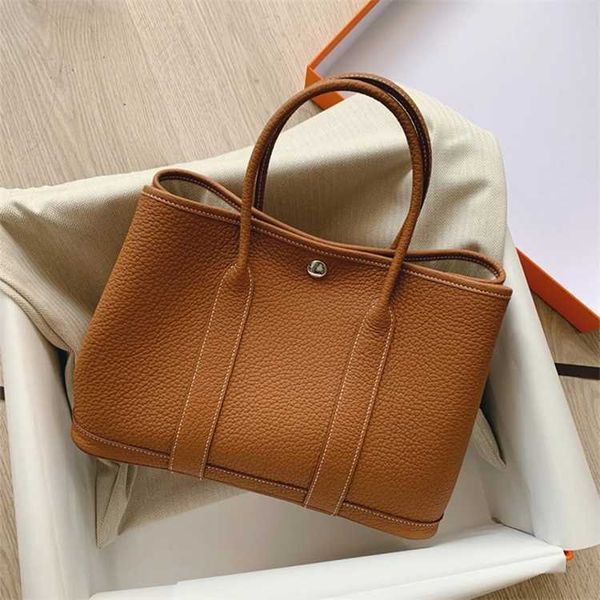 

designer authentic handbag hemrres classic garden party tote bag female large capacity commuting temperament mommy middle aged mom