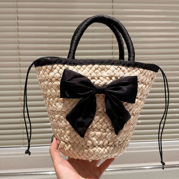 

Fashionable Bowknot Bucket Beach Women Hollow Out Crochet Totes Handmade Straw Woven Vegetable Basket Summer Vacation with Drawstring Small Bag, Cream