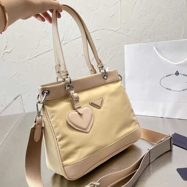 

22 new canvas oxford fabric water quality sense leisure professional commuter bag love pendant big tote bag shopping bag 230519