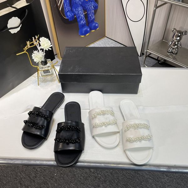

2023 summer new women's slippers flat heel open toe pearl sandals versatile one word beach vacation beautiful women's shoes, Black