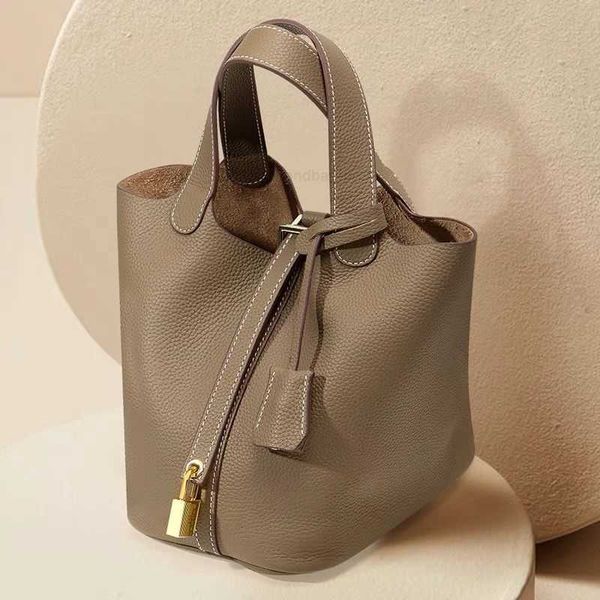 

a designer tote bag her mas handbag picotin lock cargo bags vegetable basket women's leather your bucket small bride