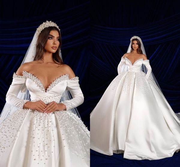 

gorgeous pearls beaded dubai arabic turkey ball gown wedding dresses with long sleeves pockets off the shoulder formal bridal satin vestidos, White
