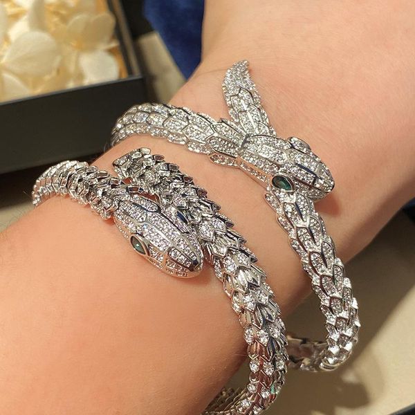 

bangle european and american luxury studded greeneyed snake biting tail crosswrapped single circle snake bracelet for women, Black