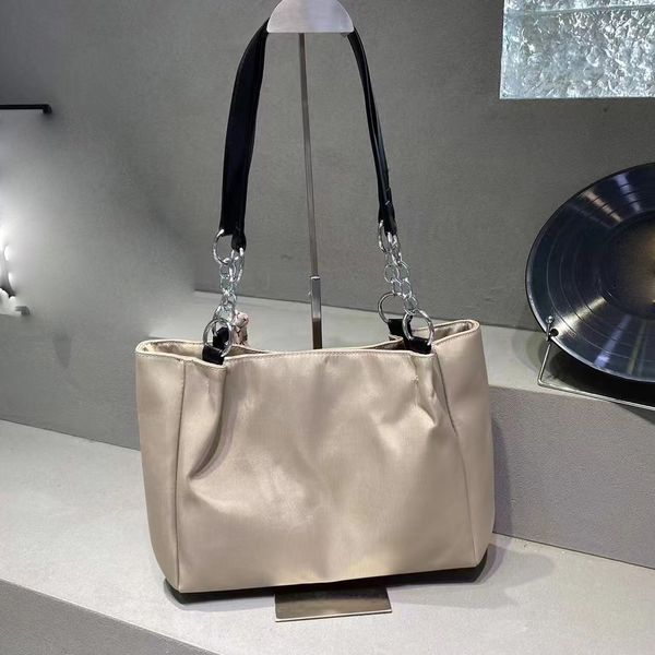 

prade designer bags tote bag handbag women fashionable and minimalist womens purses and handbags metal and leather combination handle toteba