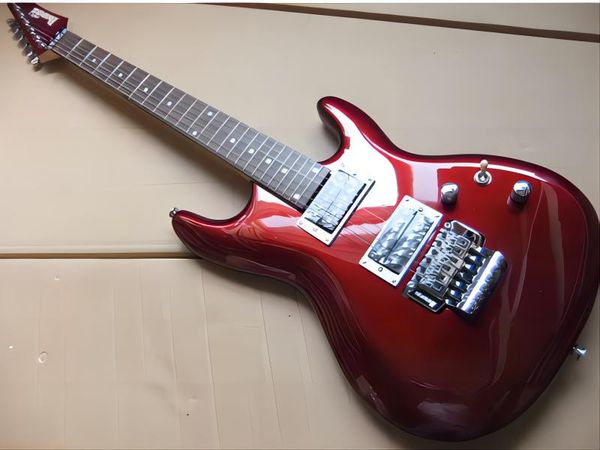 

on custom 6-string electric guitar with rosewood fingerboard chrome hardware in wine red